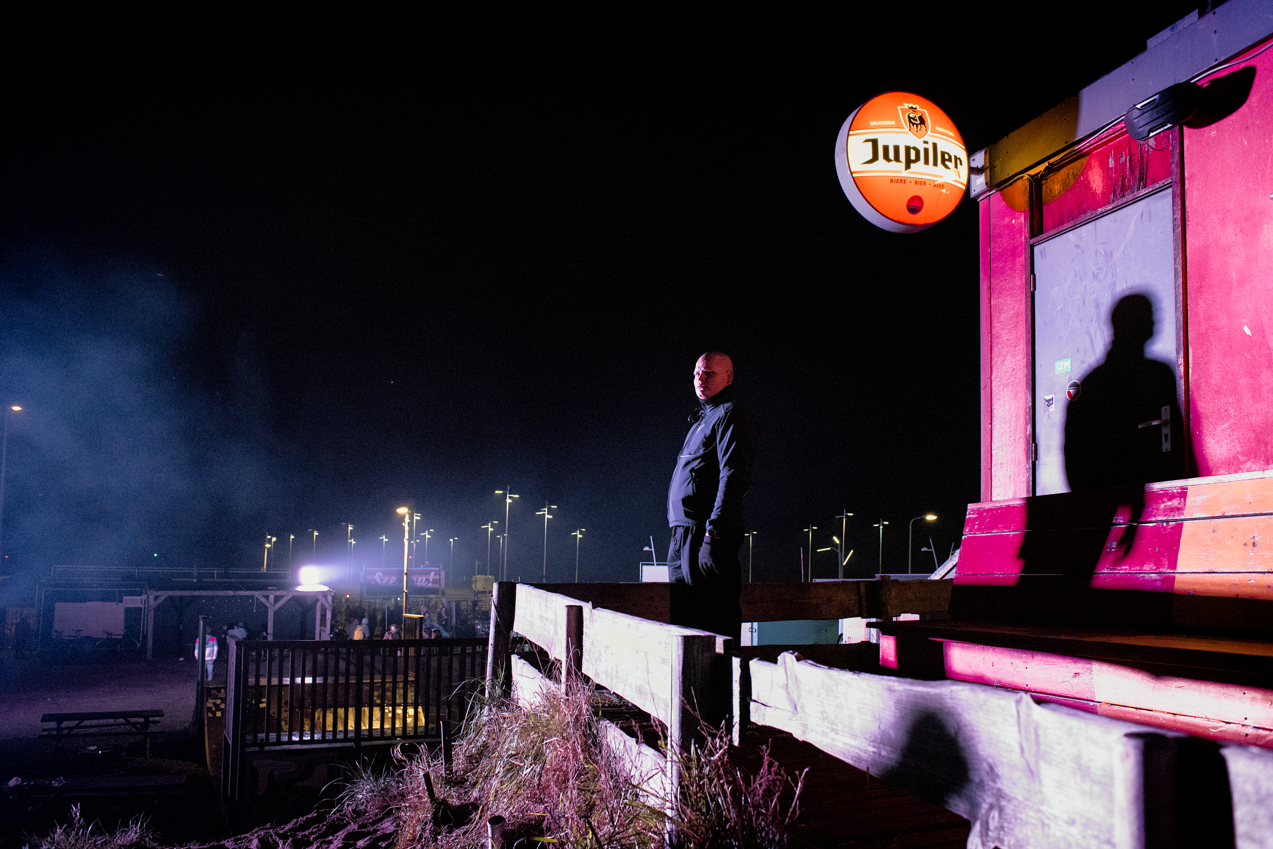 security guard, silhouetted at night